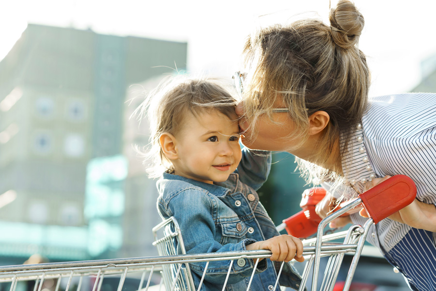 mom and child in shopping cart