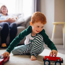 iStock image of child playing with toys, article on teaching our kids to think for themselves
