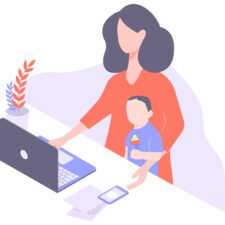 Working mom at home on computer with son