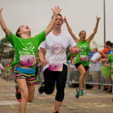 Girl finishing a 5K at a Girls On the Run 5K.