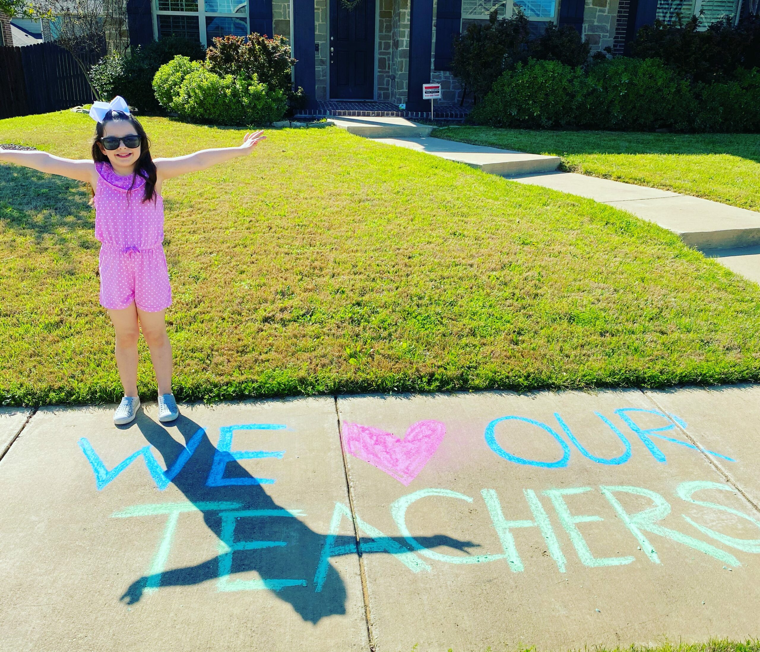 Celebrating teachers with chalk art and car parades