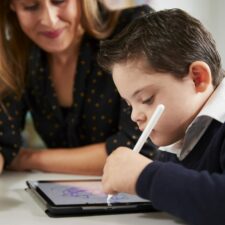 educational apps, iStock image of young boy using an educational app