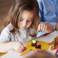 Little girl making a Mother's Day gift
