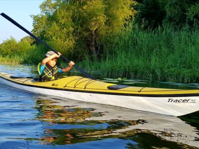 Little boy paddling the Trinity River