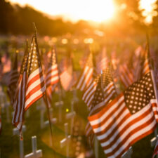 iStock, A field of American flags set up for a Memorial Day parade