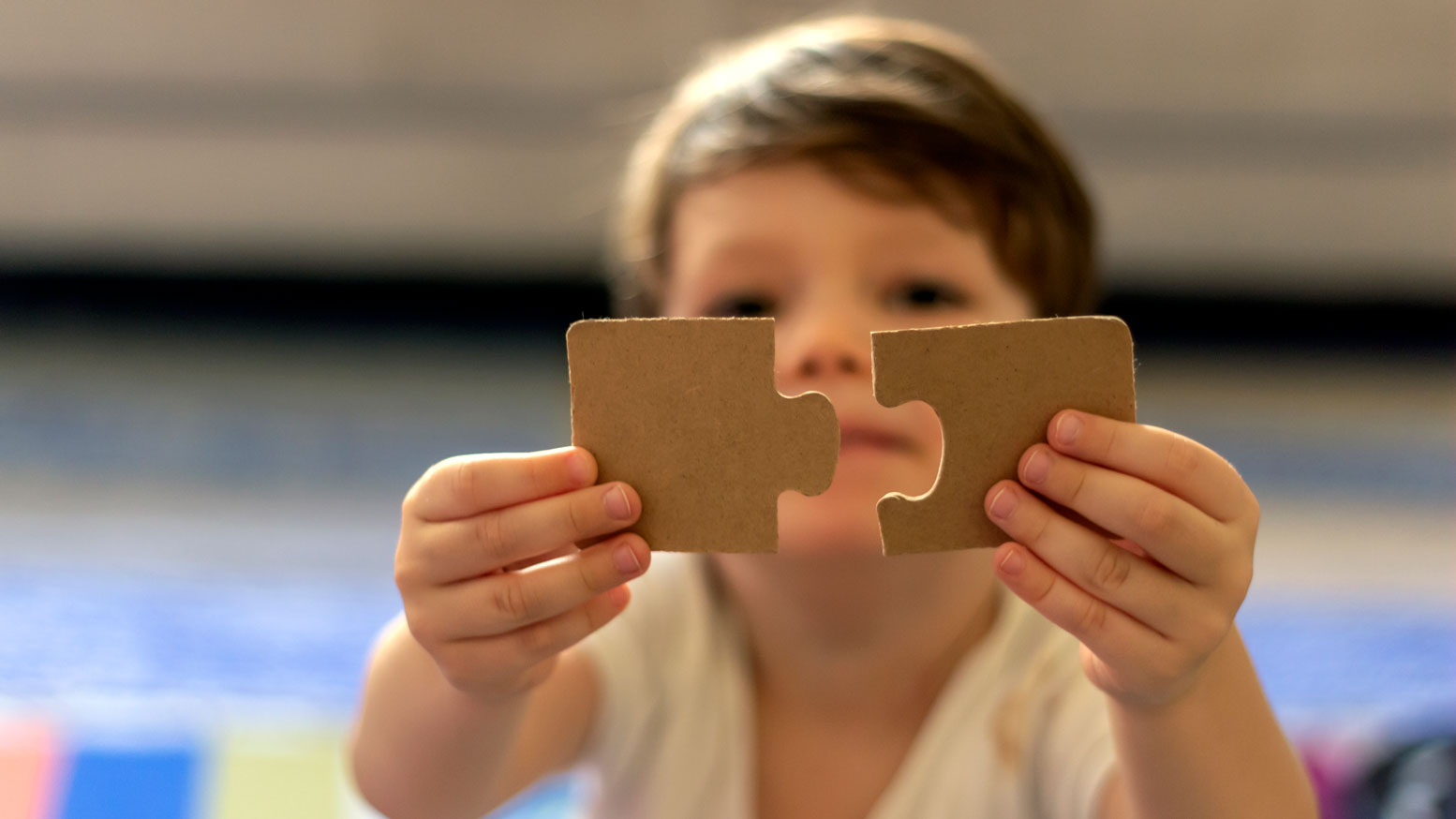 child with puzzle piece, autism, iStock