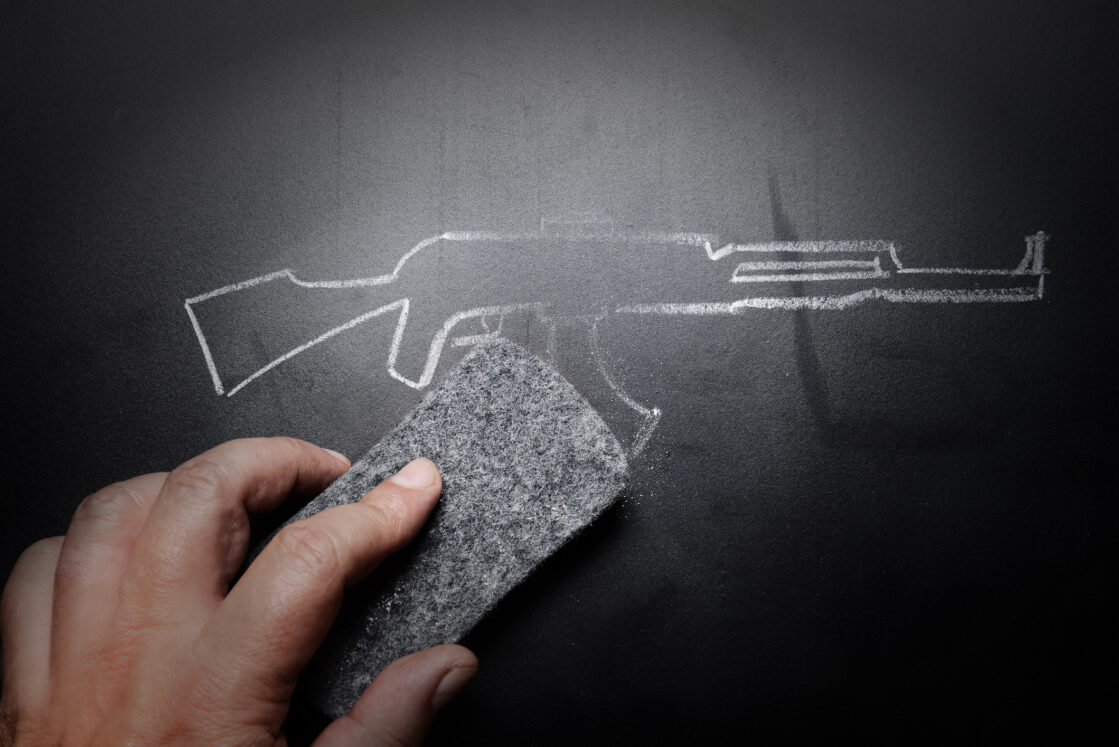 iStock image of weapon draw erased on blackboard - no violence concept, school shootings, school safety
