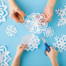 winter activities, iStock image of cutting snowflakes