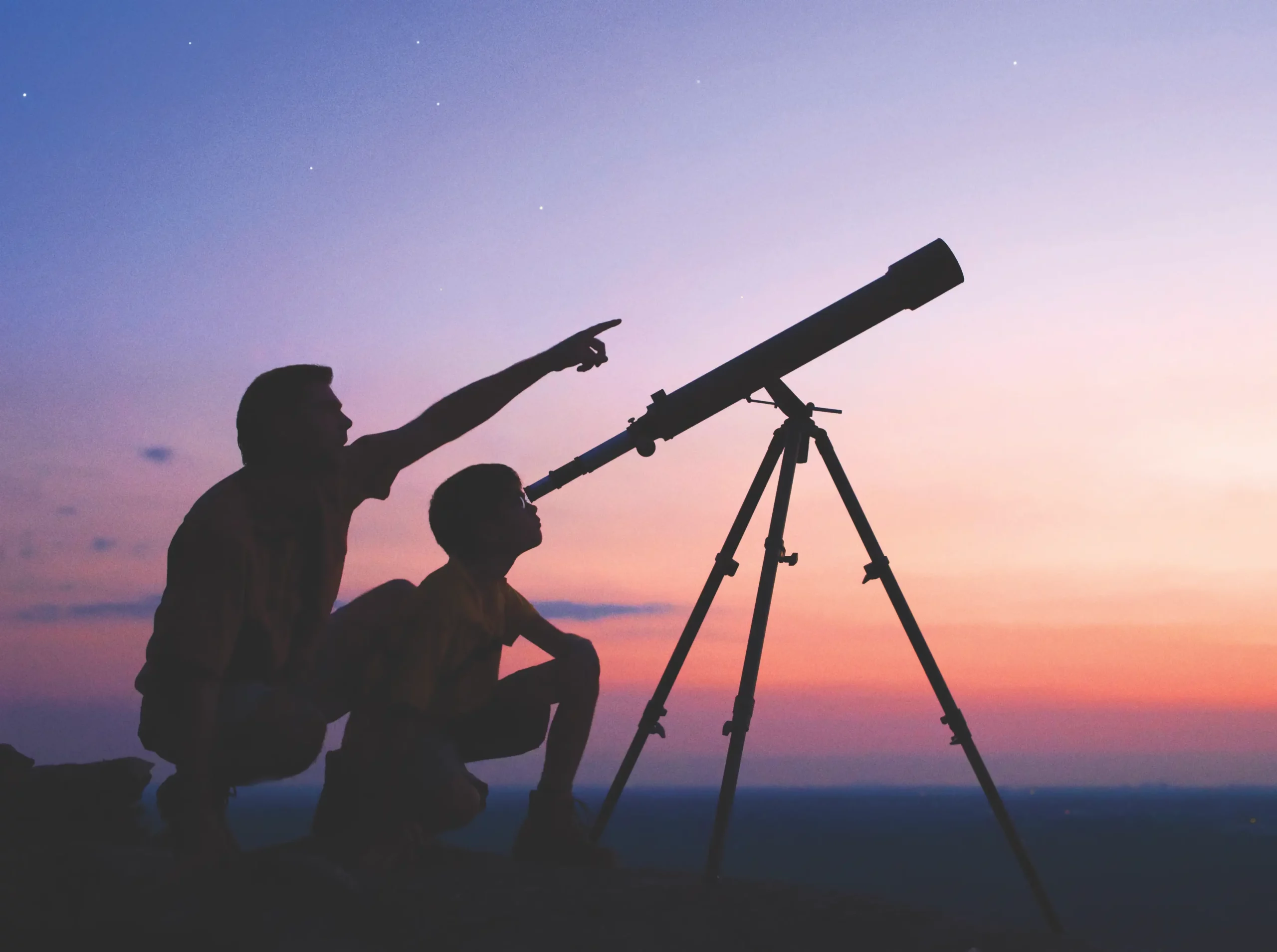 iStock image of father and child stargazing