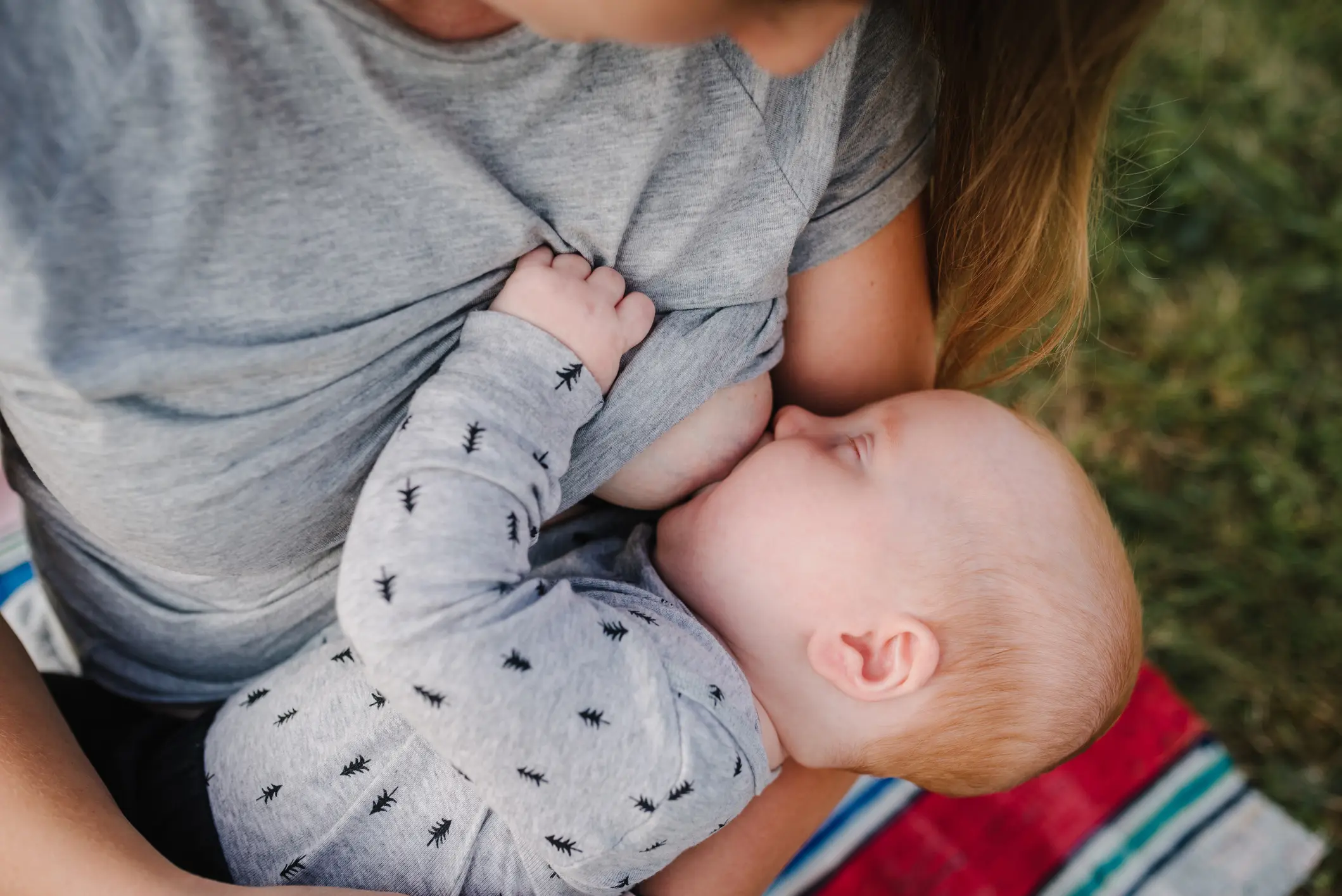 iStock image of mother breastfeeding baby, article about common breastfeeding questions