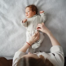 iStock image of swaddle baby, article about baby products you'll actually need to use