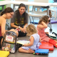 Children and parents reading and playing at Reby Cary Youth Library, courtesy of the City of Fort Worth