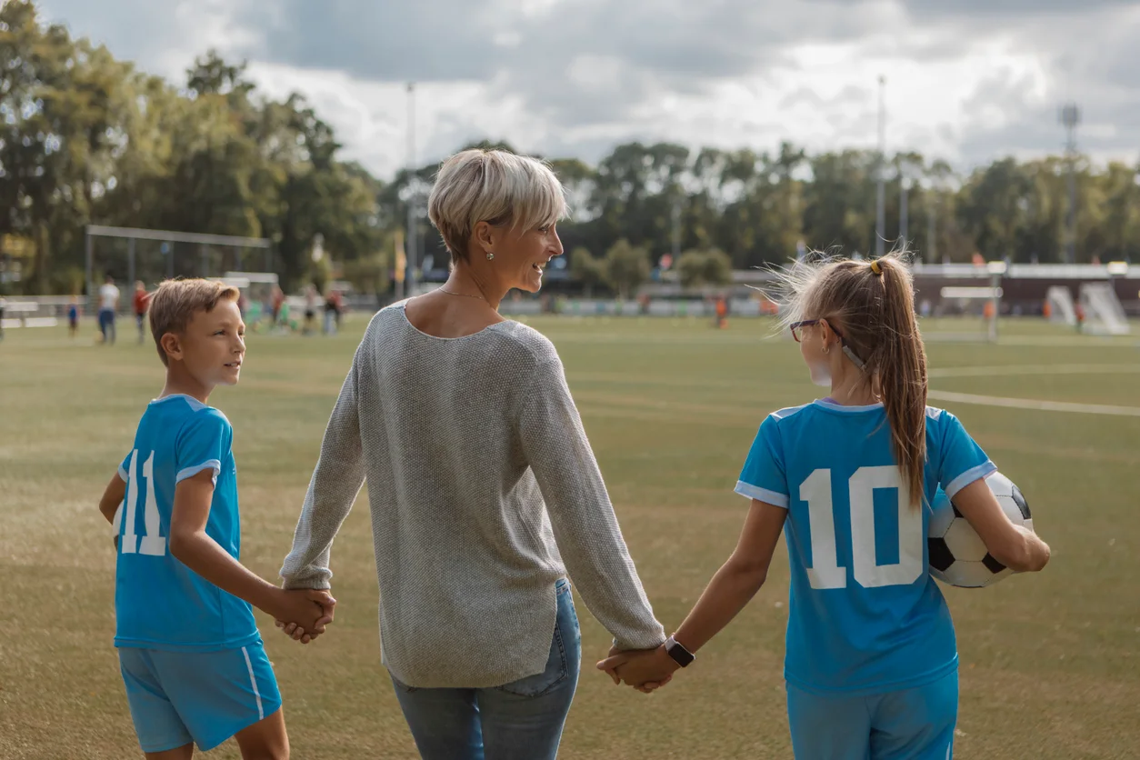 iStock image of a mom with her kids at a soccer game