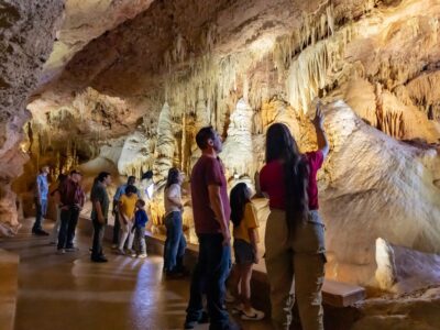 Family travel vacation destination to New Braunfels, Texas. The Cathedral Room's colors are significantly more visibile thanks to the new lighting on the Hidden Wonders tour at Natural Bridge Caverns