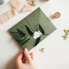 iStock image of wedding invitation, advice column on Mrs. McVeigh’s Manners: Fairness in Invitations & Gift Giving