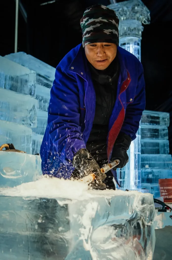 Harbin artisan carves ice sculpture for Elf ICE!, photo courtesy Gaylord Texan Resort