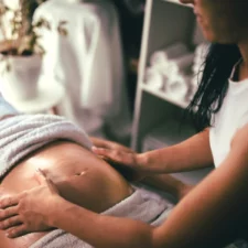 iStock image of woman during prenatal massage, article on Where to Get a Prenatal Massage in Fort Worth