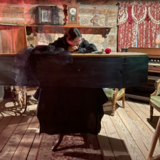 Murder at the Village: A Log Cabin Village Murder Mystery