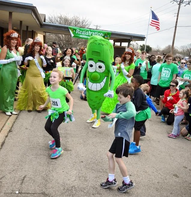 Children running and costumed revelers at the St. Paddy's Pickle Parade and Palooza through downtown Mansfield, photo courtesy Pickled Mansfield Society