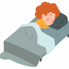 iStock illustration of boy sleeping in bed, for article on bedwetting