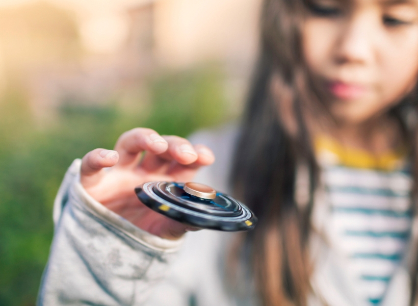 iStock Girl with a fidget spinner stock photo 