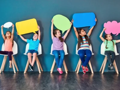 iStock image, of children holding up signs to express themselves, for article on self-advocacy