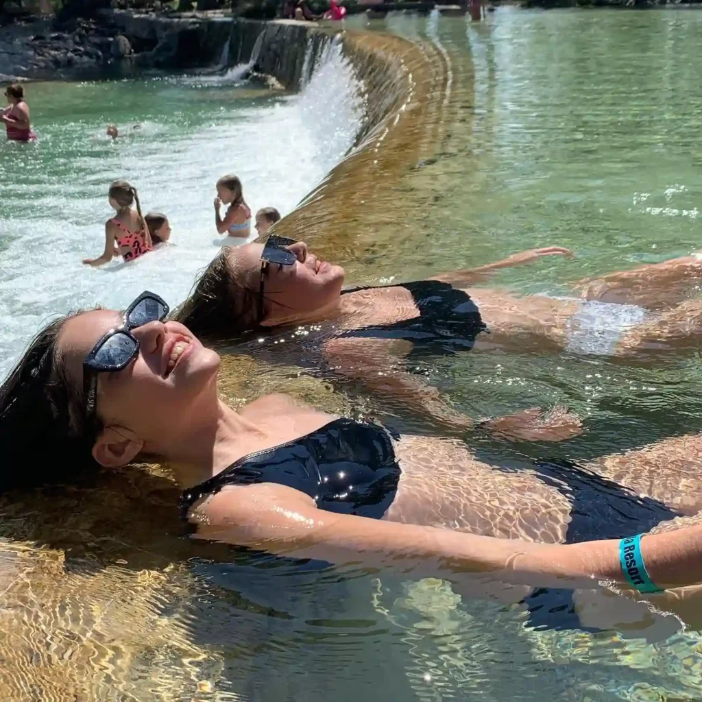 Kids playing and relaxing along the Frio River in the Texas Hill Country, photo courtesy of Rio Bella Resort
