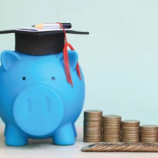 iStock image of piggie saving bank wearing graduation cap, for article on how Texas parents can saving money for college through a 529 plan
