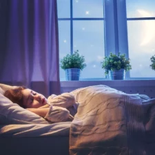 iStock image of sleeping child, for article on an age-by-age guide for getting your kids to sleep