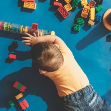 iStock image of baby on the floor playing with toys