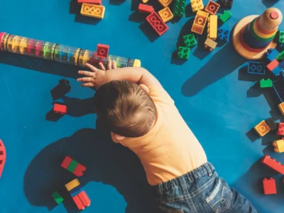 iStock image of baby on the floor playing with toys