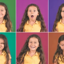 iStock image of little girl making different facial expressions to demonstrate various emotions, for an article on teaching emotional intelligence to children
