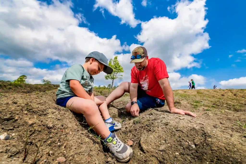 Father and son digging at Crater of Diamonds , credit_courtesy of the Arkansas Department of Parks, Heritage and Tourism