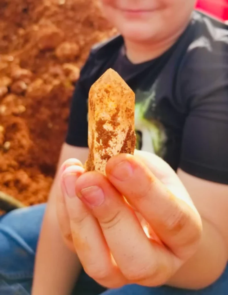 Avant Mining, child holding a crystal