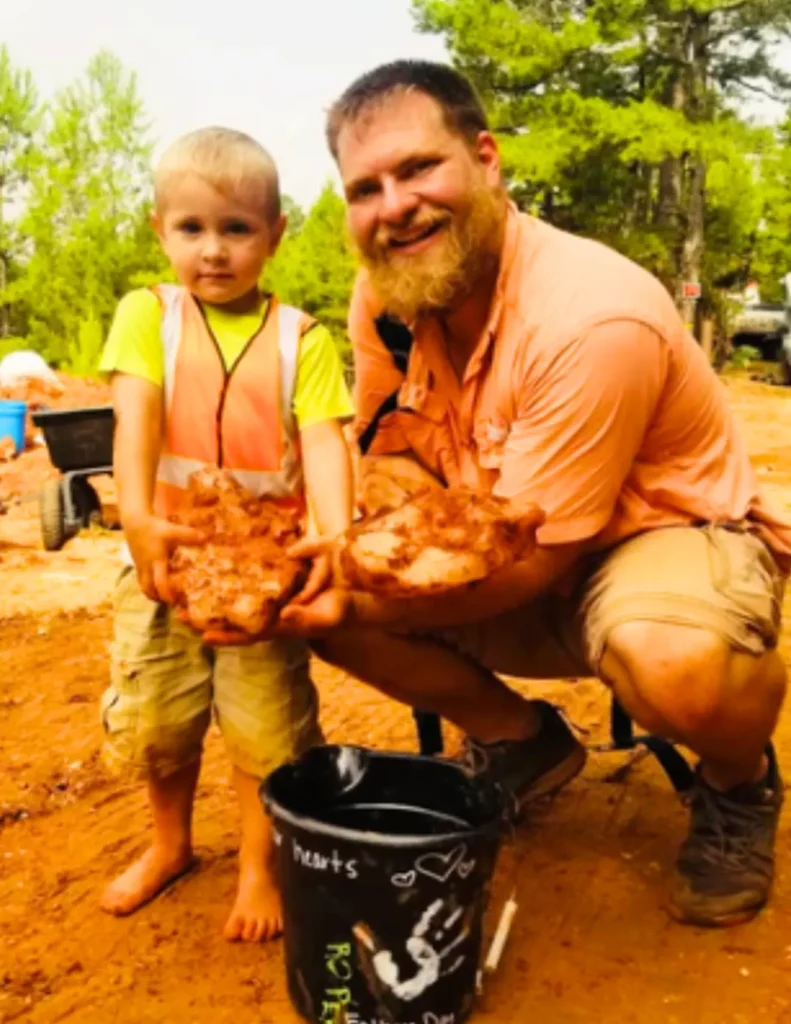 boy and man with large crystals, at Avant Mining in Arkansas
