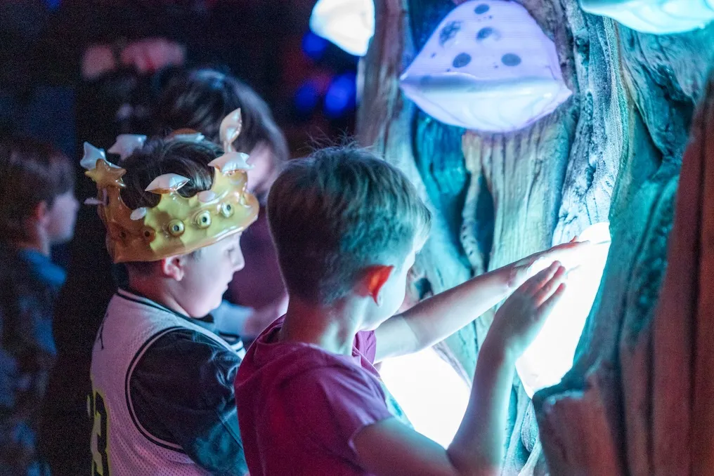 Two boys playing at Meow Wolf Grapevine, for Spring Break: Brain Bean Buddies event