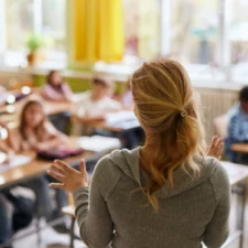 iStock image of teacher in front of students in her classroom